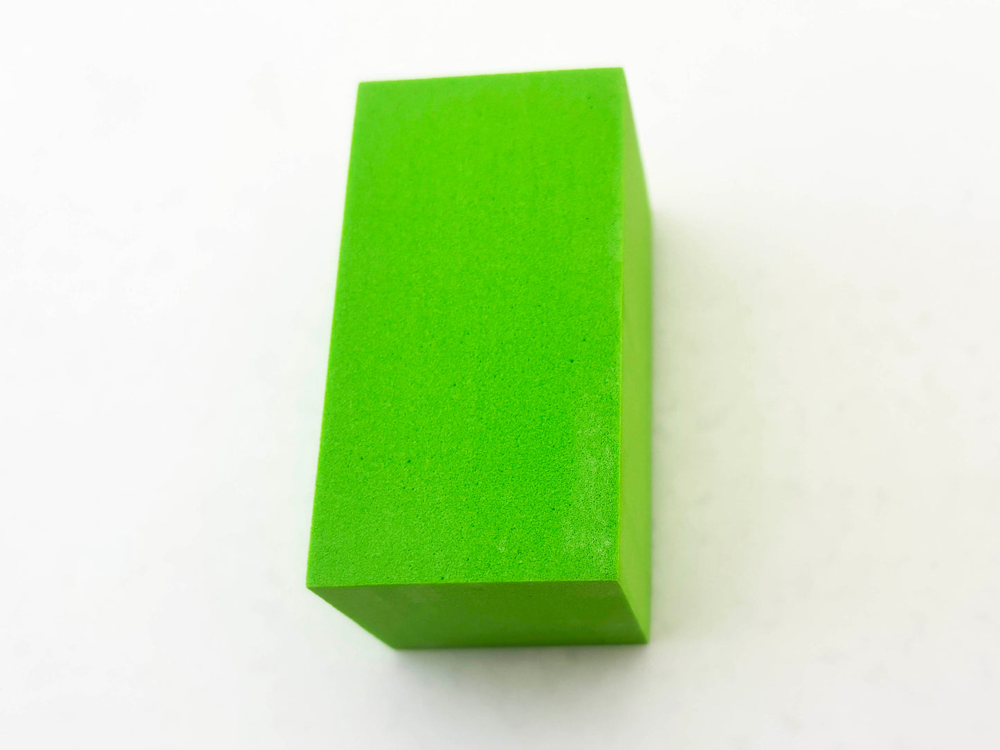 Green rectangular block on a white background