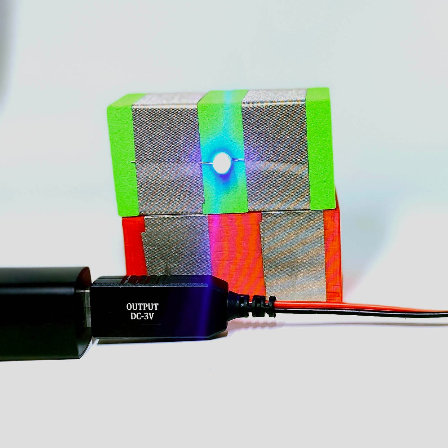 Usb Plug in a power bank with a Green light and red power TapeBlock behing