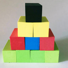 Load image into Gallery viewer, A pyramid of colorful foam blocks, Layer 1 - 4 green, Layer 2 - red, blue and red, Layer 3 - 2 yellow and then Layer 4 - black on top

