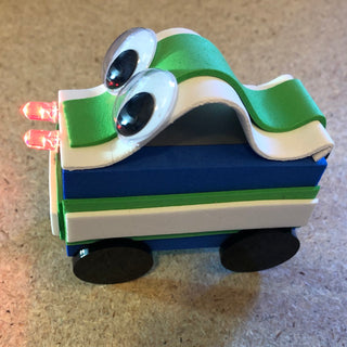 TapeBlock Car Character with Googly eyes and a light up red headlights