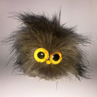 A Short Brown Fur TapeBlock with Large yellow glass and a yellow light up nose