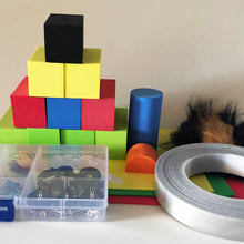 Load image into Gallery viewer, Contents of the TapeBlock making kit in a pile including Foam Blocks and sheet foam, LEDs, switches, motors and conductive tape, fur and eyes are included. You can see more of the fur and tape in this photo and the small components are in the plastic box

